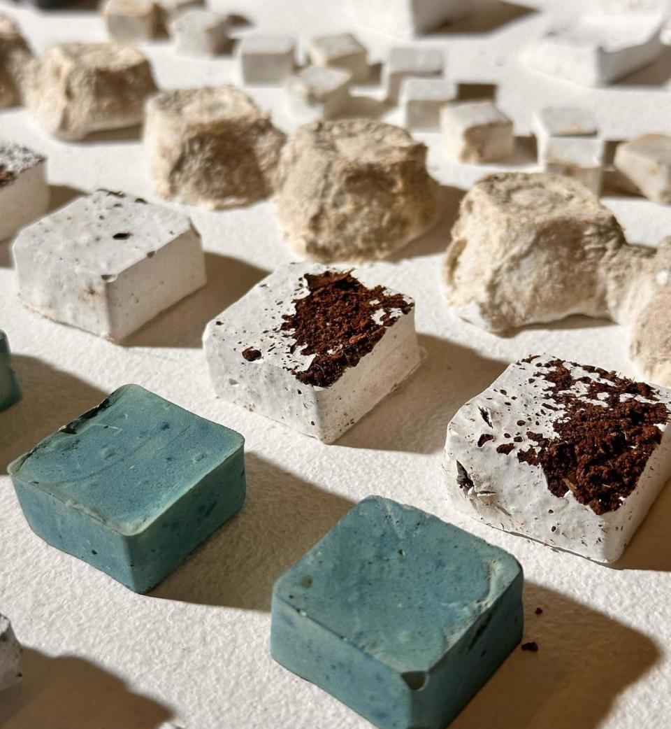 Textured squares of innovative materials displayed at New Designers 2024, showcasing contemporary design and sustainable creativity.