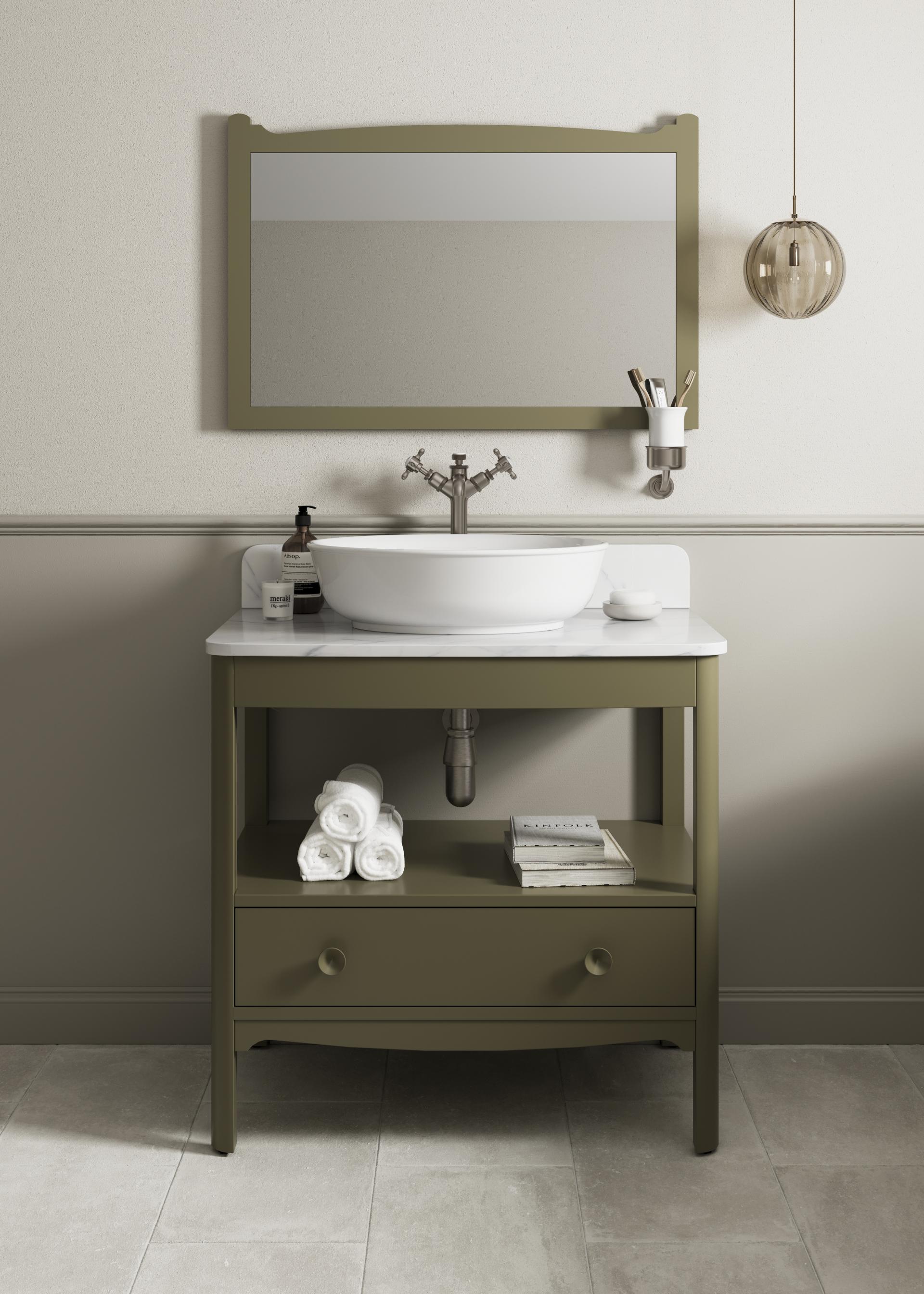 Modern bathroom vanity with a circular sink, olive green cabinetry, and stylish accessories, showcasing Japanese Nouveau design elements.