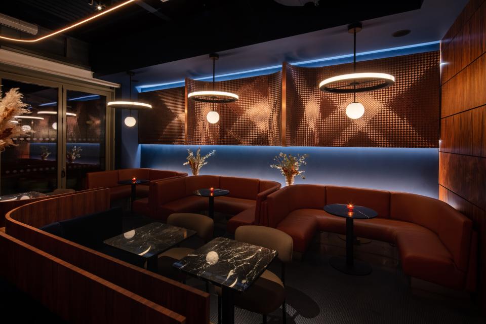 Stylish interior of M’Arks Sky Bar featuring cozy seating, modern lighting, and elegant decor elements in London.