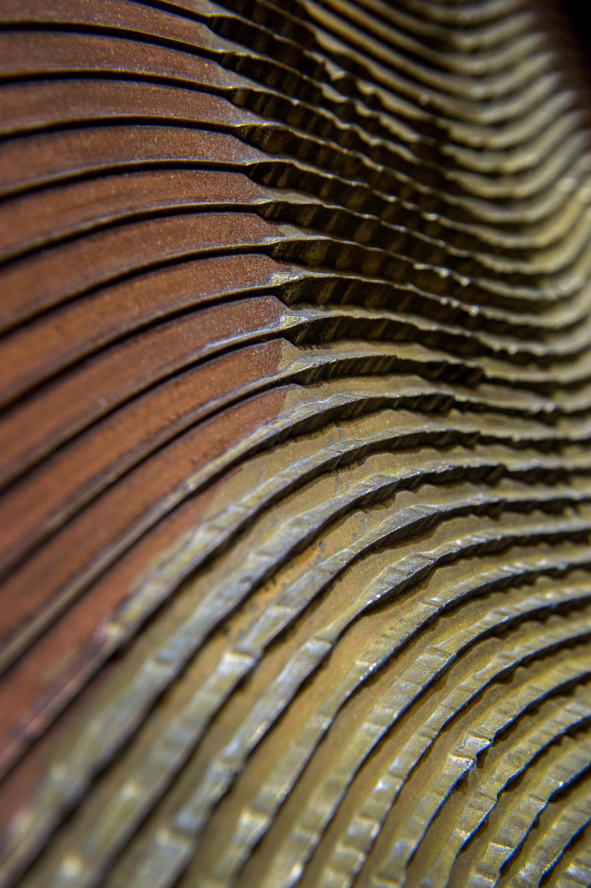 Textured surface design showcasing layered materials, representing innovations in surface design at the Surface Design Show 2020.