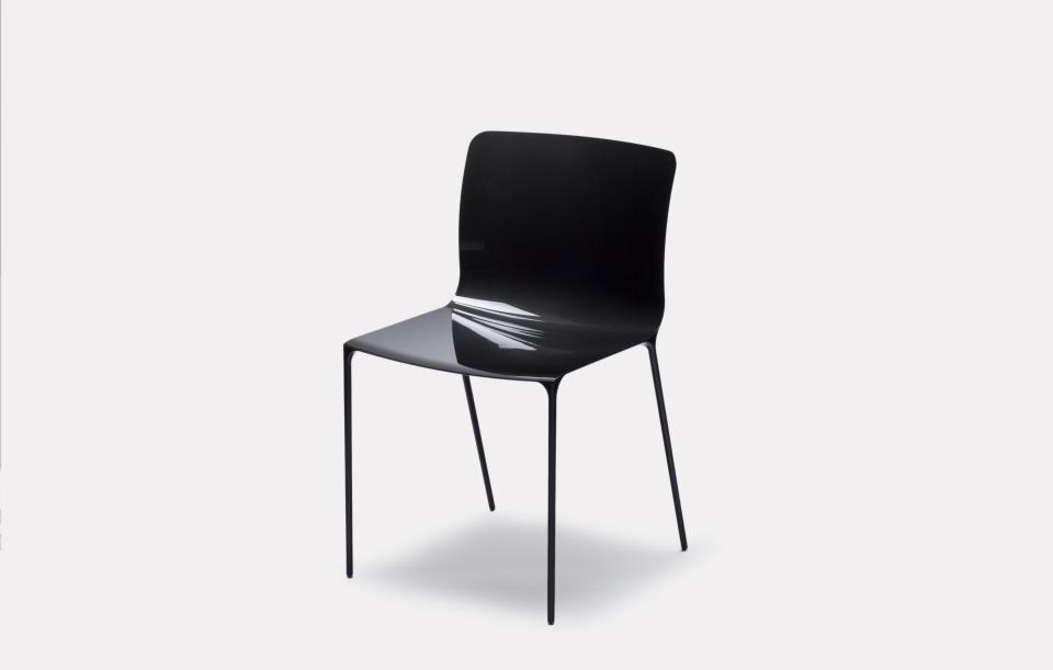 Sleek black contemporary chair from Established & Sons' new seating collection, showcasing minimalistic design and elegance.