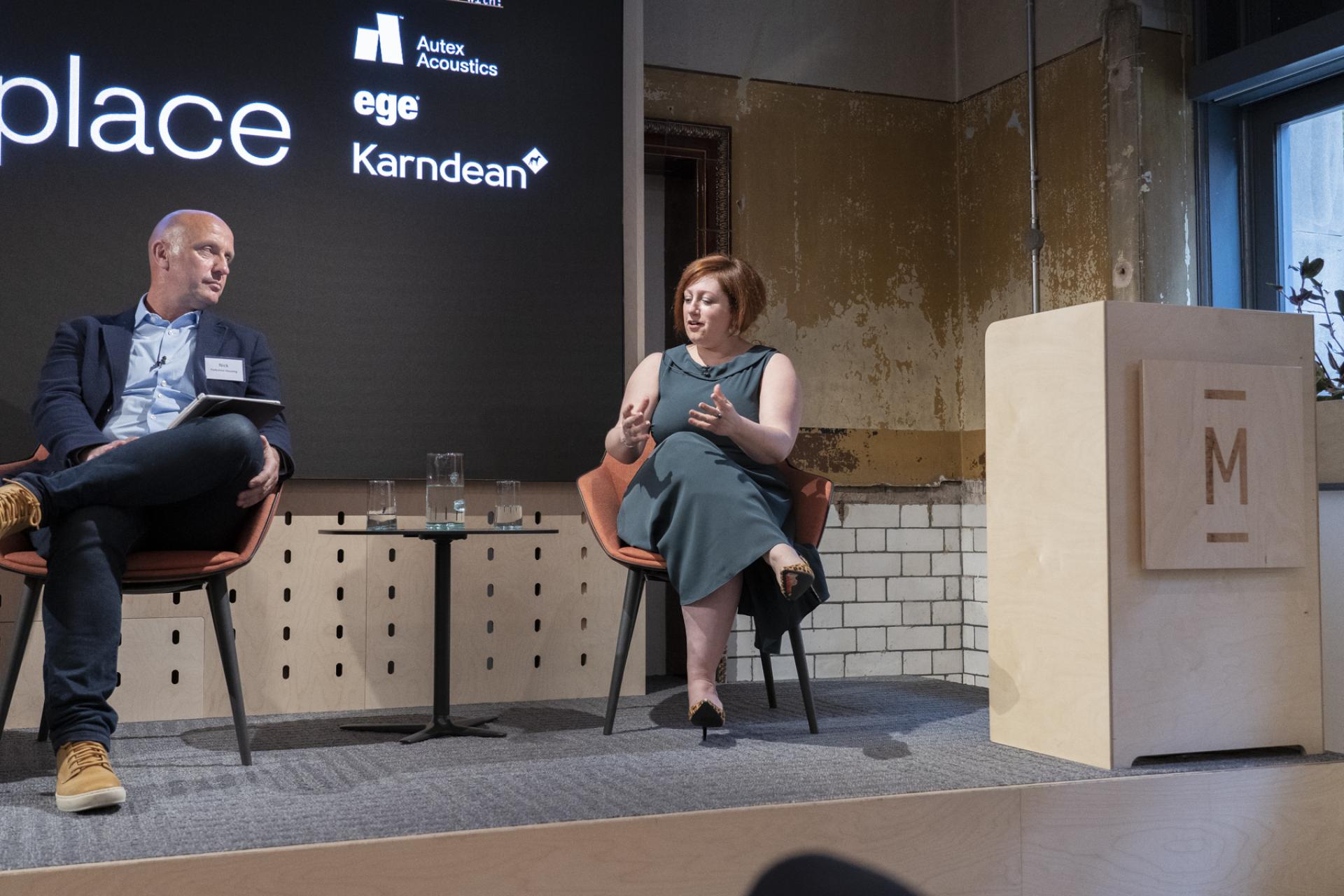 Discussion about the Future of Workplace at Material Source Studio seminar, featuring two speakers on stage.