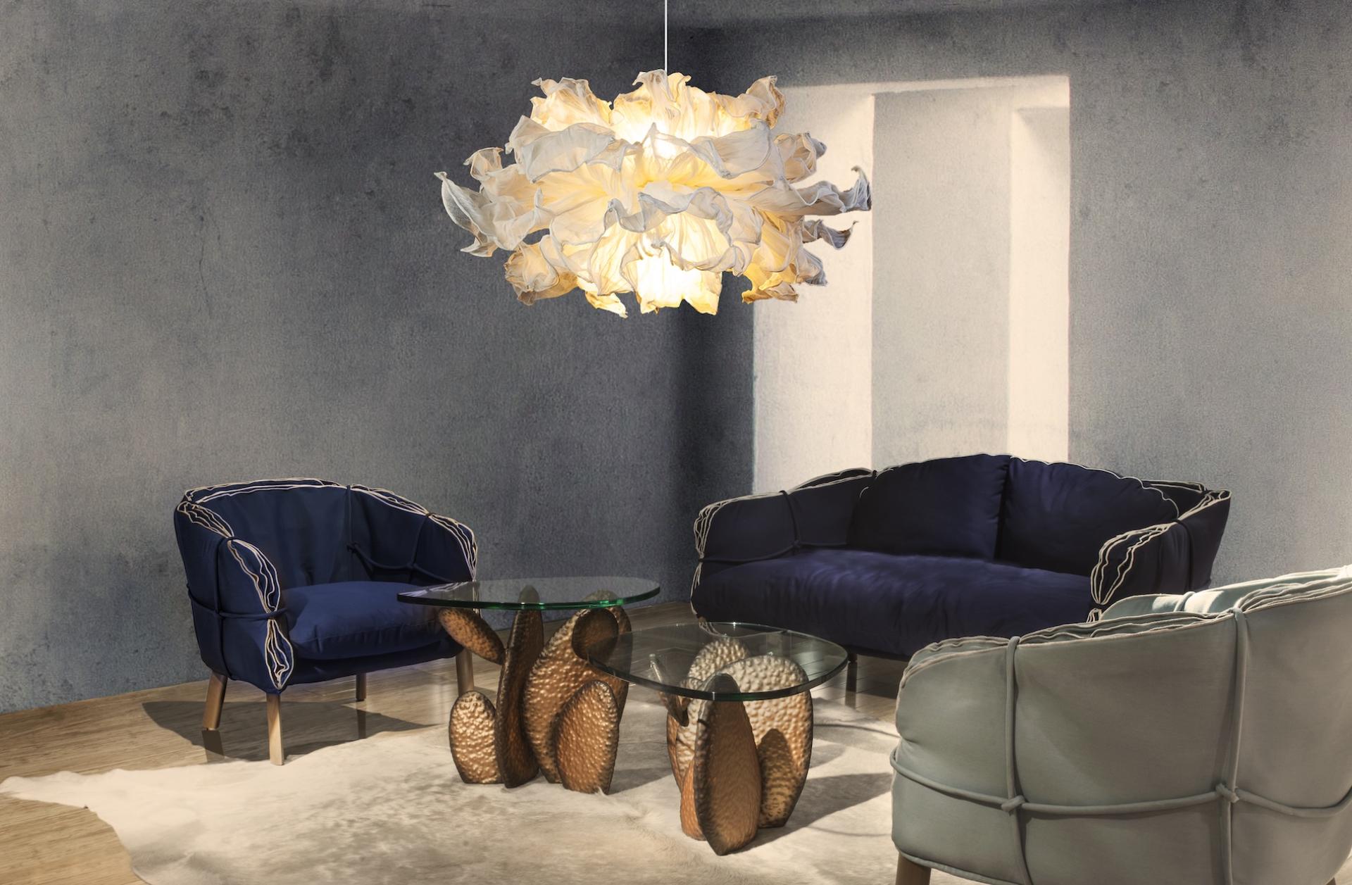 Stylish living room featuring elegant seating and a unique floral pendant light, celebrating spring's fresh aesthetic.