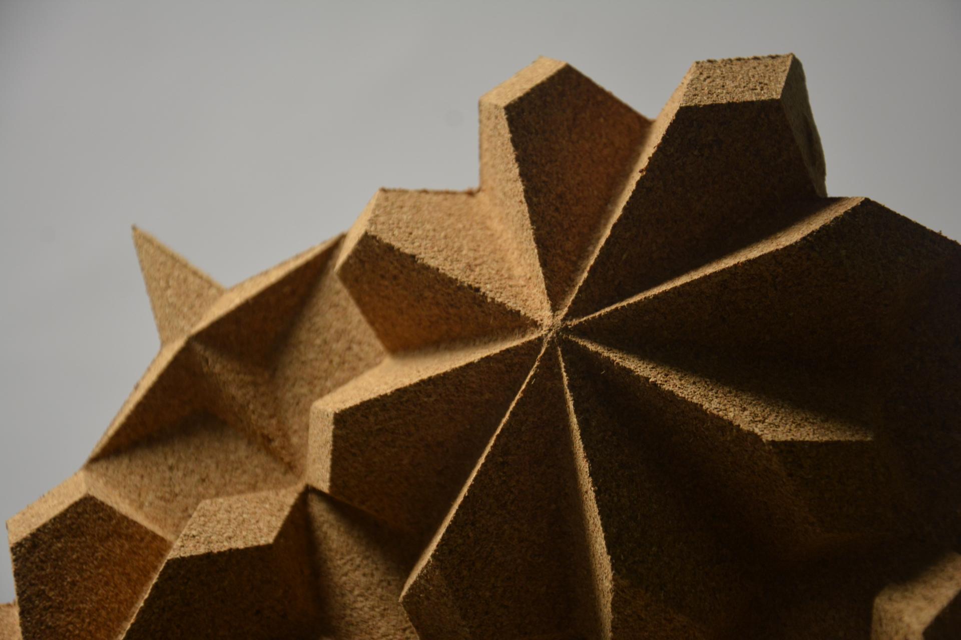 Textured geometric sculpture showcasing intricate star-like patterns, highlighting innovative material design at New Designers 2024.