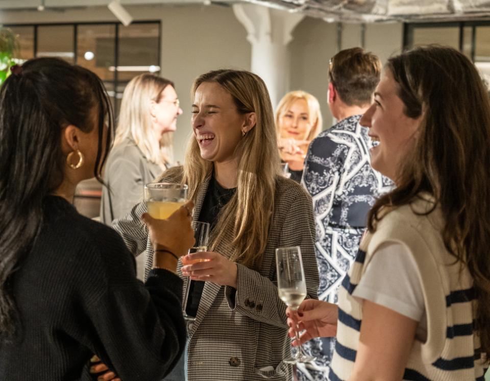 Guests enjoying drinks and lively conversation at the Community festival event at Material Source Studio in Manchester.