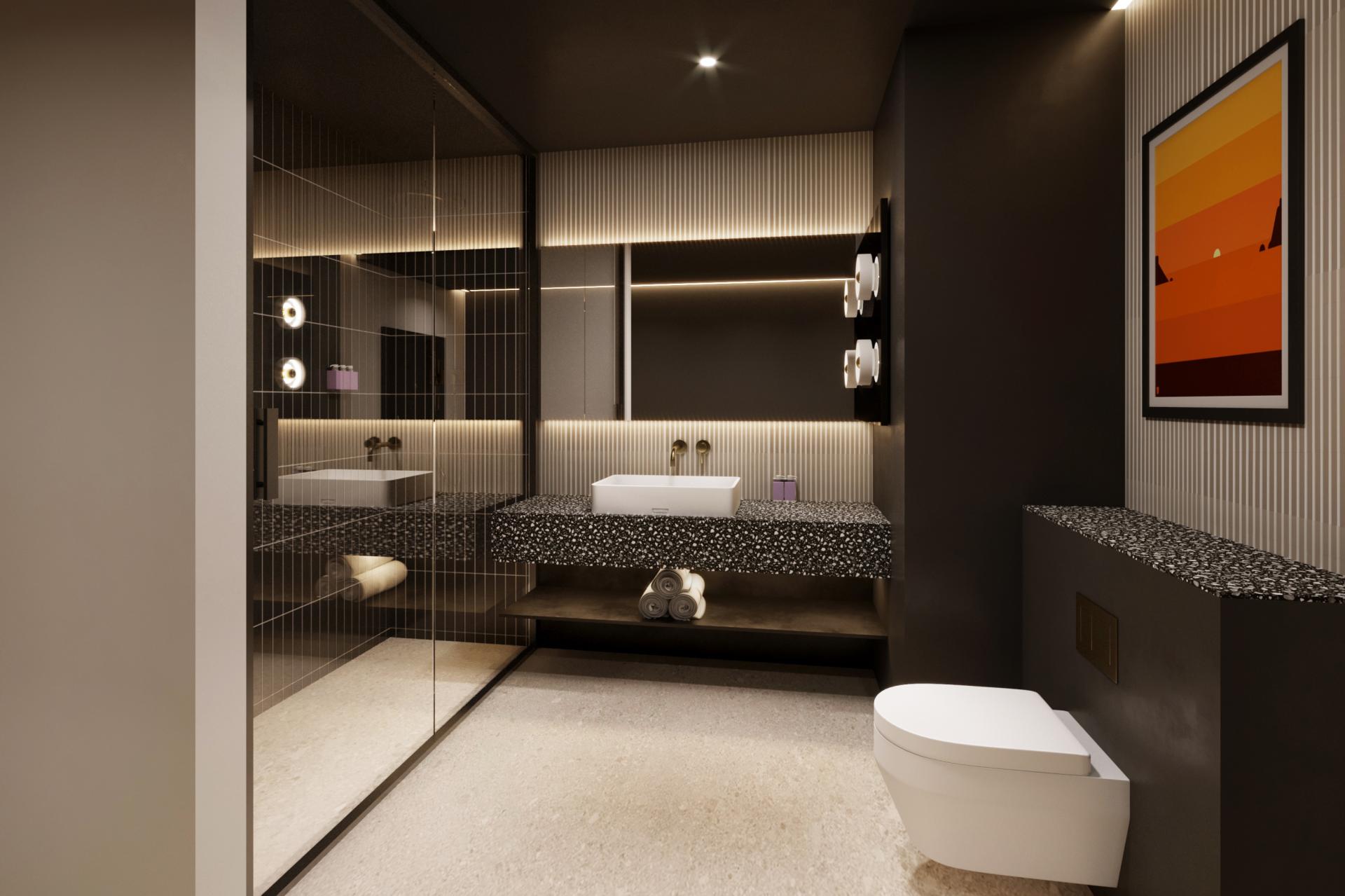 Stylish hotel bathroom featuring modern fixtures, terrazzo countertop, and ambient lighting in Tribe hotel, Malta.