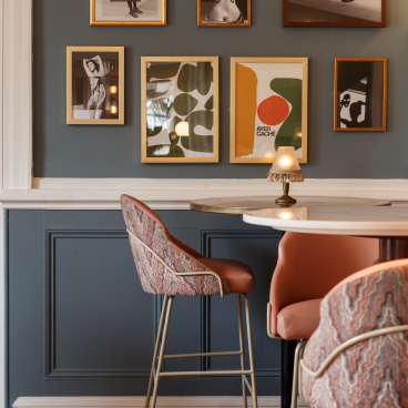 Heritage-inspired interior featuring framed art and stylish seating at The Orange Tree in Congleton.