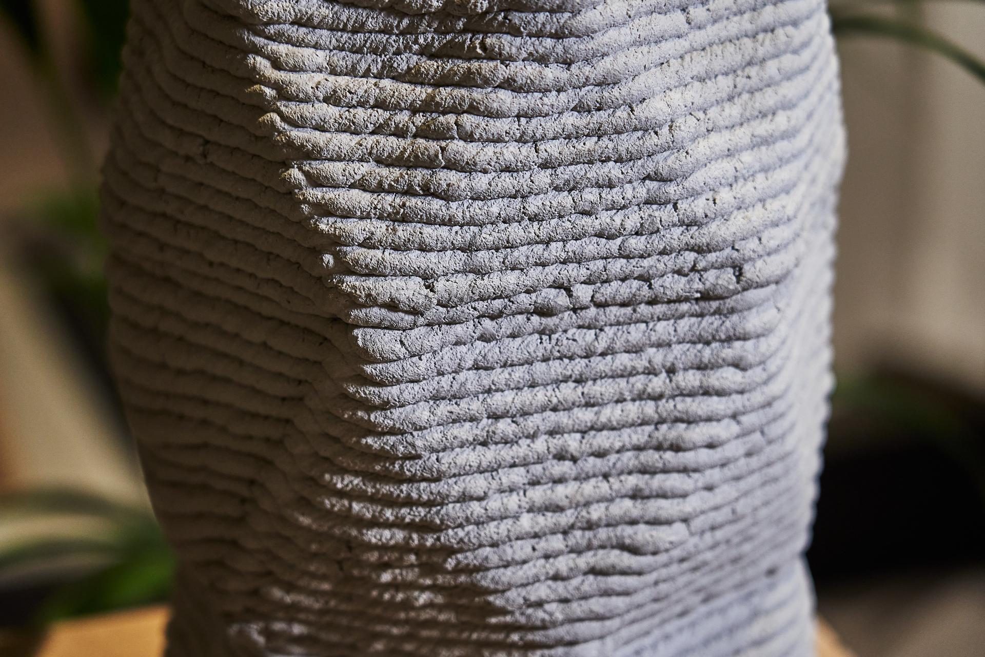Textured concrete sculpture displayed at Material Source Studio, showcasing innovative concrete design and sustainability in architecture.