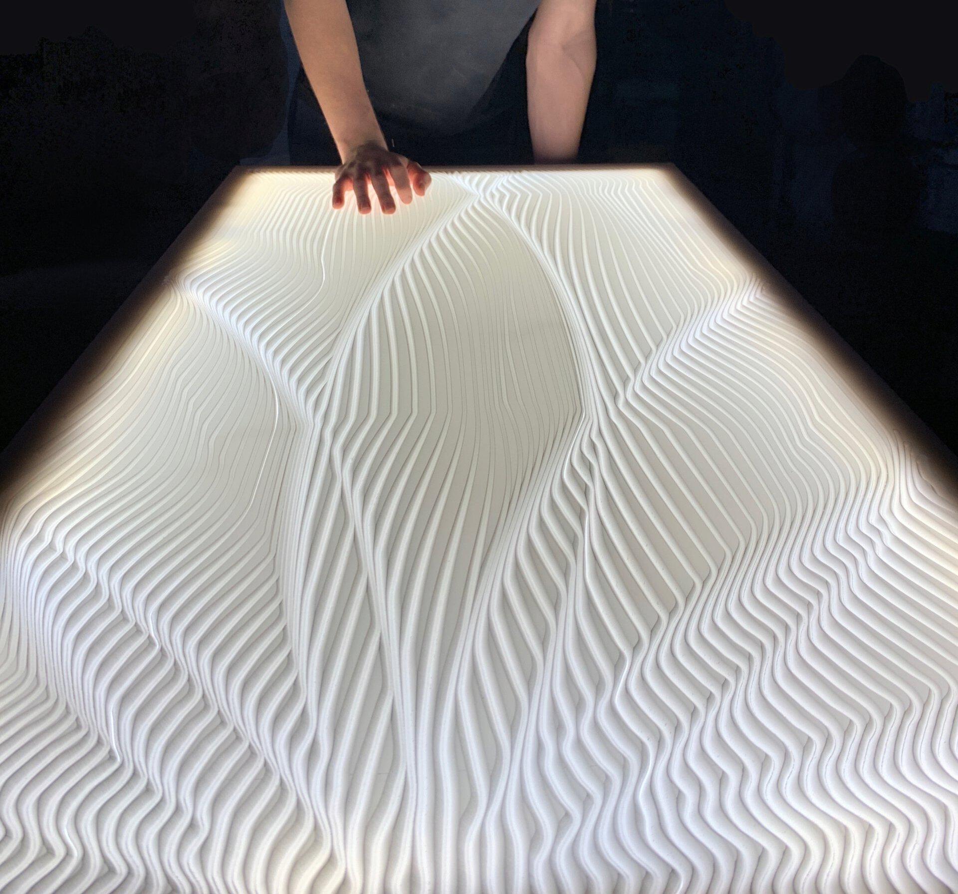 Textured illuminated wall surface by CDUK showcasing M|R Walls design for unique interior spaces in the UK and Ireland.