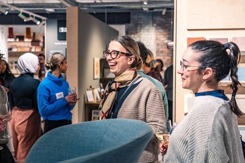 People laughing together at an event