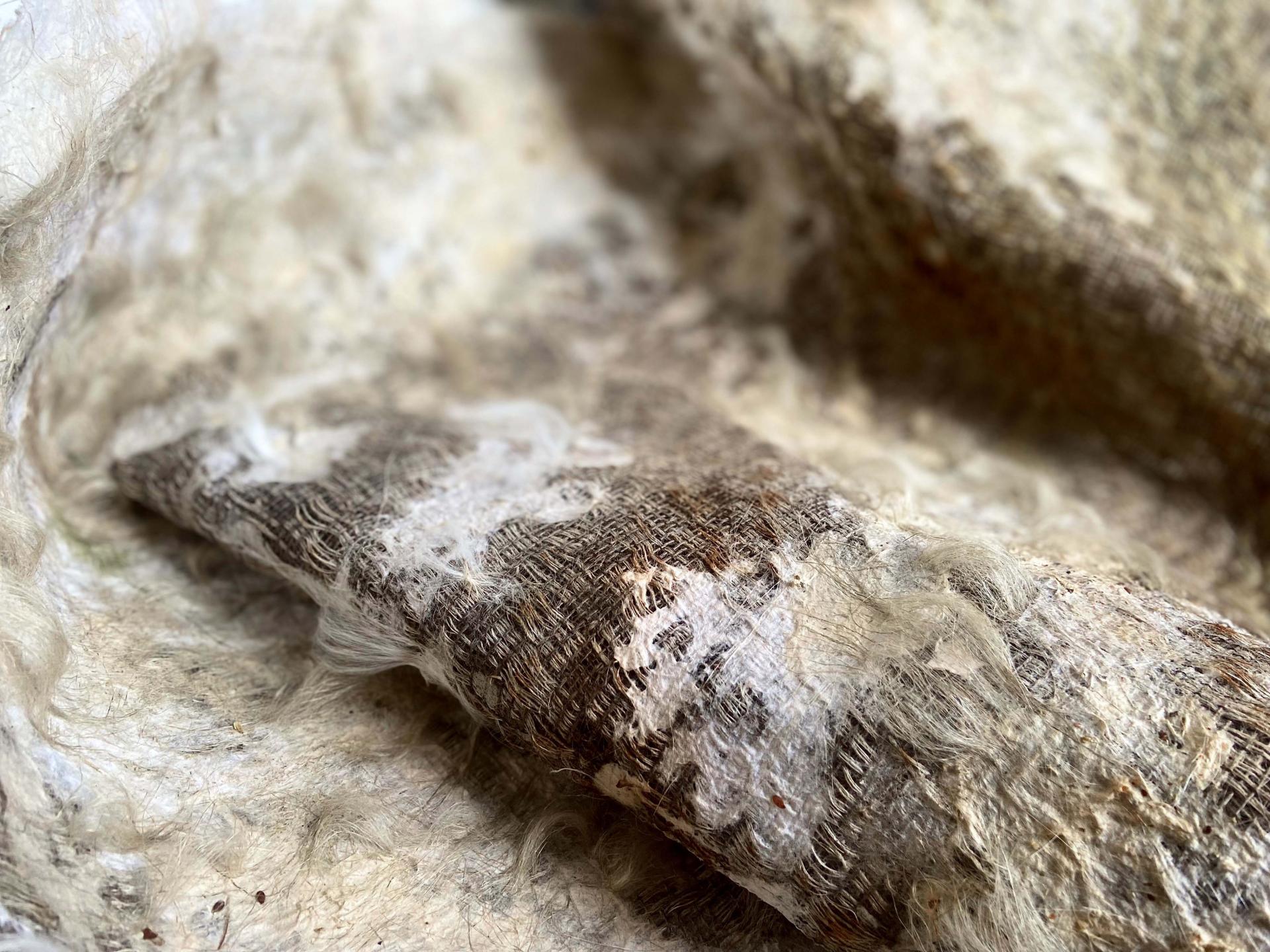 Textured fabric showcasing natural fibers, highlighting innovative textile design concepts from New Designers 2024 exhibition.