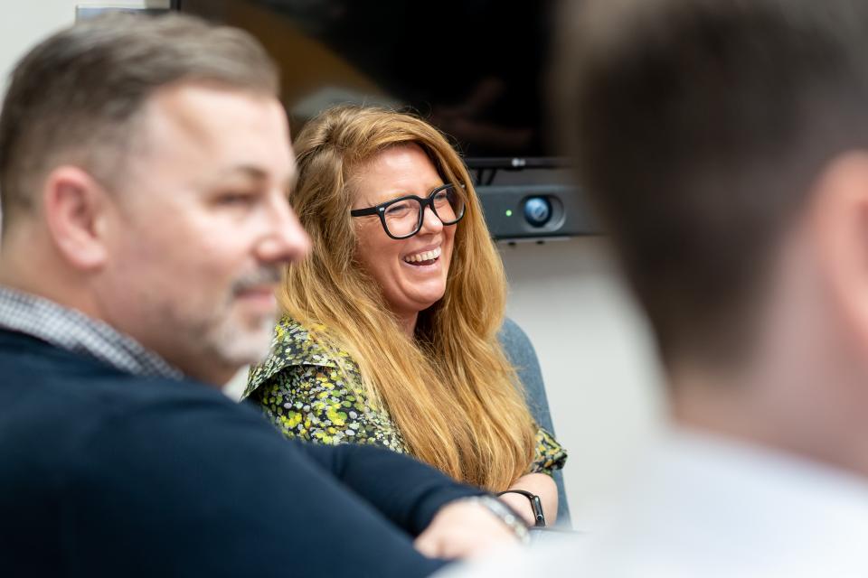 Participants engage in a lively discussion at a sustainability seminar, focusing on combating the climate crisis.