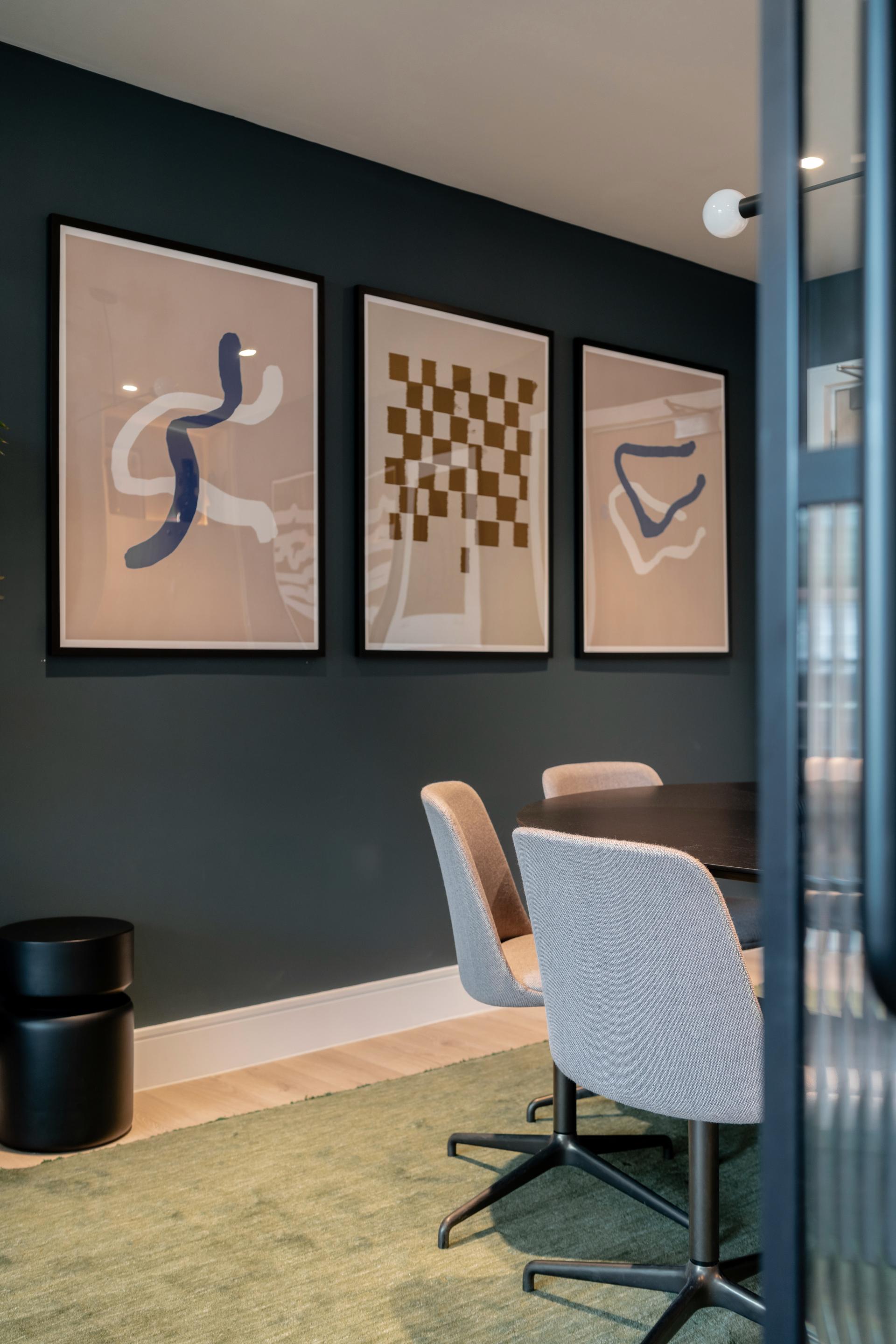 Stylish co-living space featuring abstract art and modern furniture, enhancing The Apiary's vibrant atmosphere in the capital.