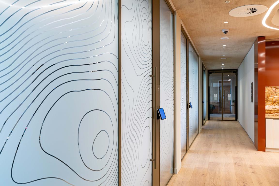 Radii supports tp bennett & Overbury with bespoke bronze framed glazed partitions at banking HQ in London.