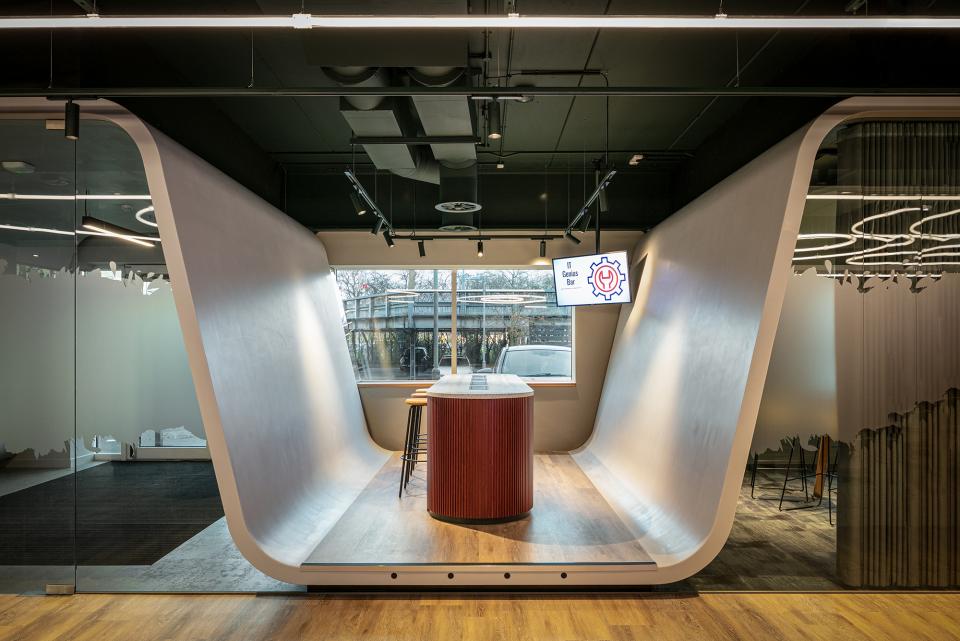 Modern office space at PZ Cussons’ Manchester headquarters featuring a sleek IT Genius Bar and innovative design elements.