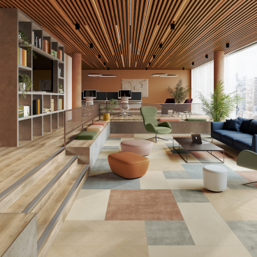 Modern commercial interior showcasing vibrant color and texture elements, promoting wellbeing and creativity in workspace design.