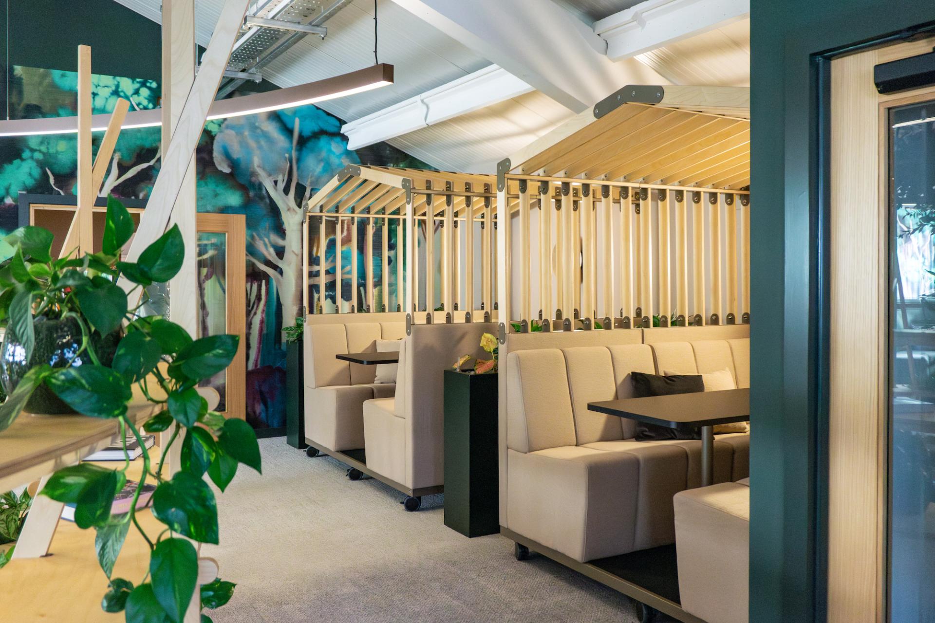 Modern collaborative workspace at the Liz Hickson Academy, featuring comfortable seating and vibrant decor promoting wellbeing.