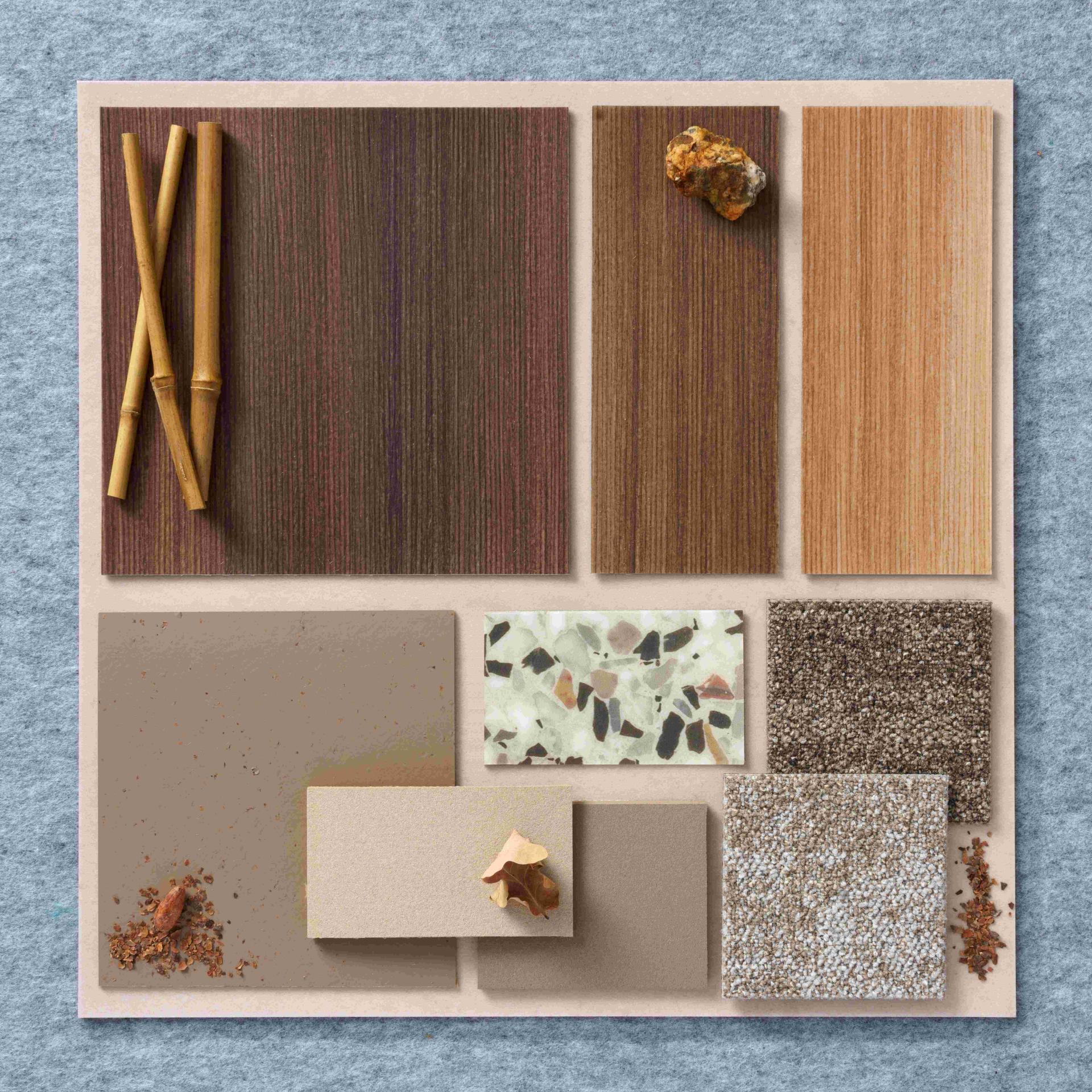 Colorful samples of Forbo's Allura LVT collection showcase various contemporary wood and stone-inspired designs.