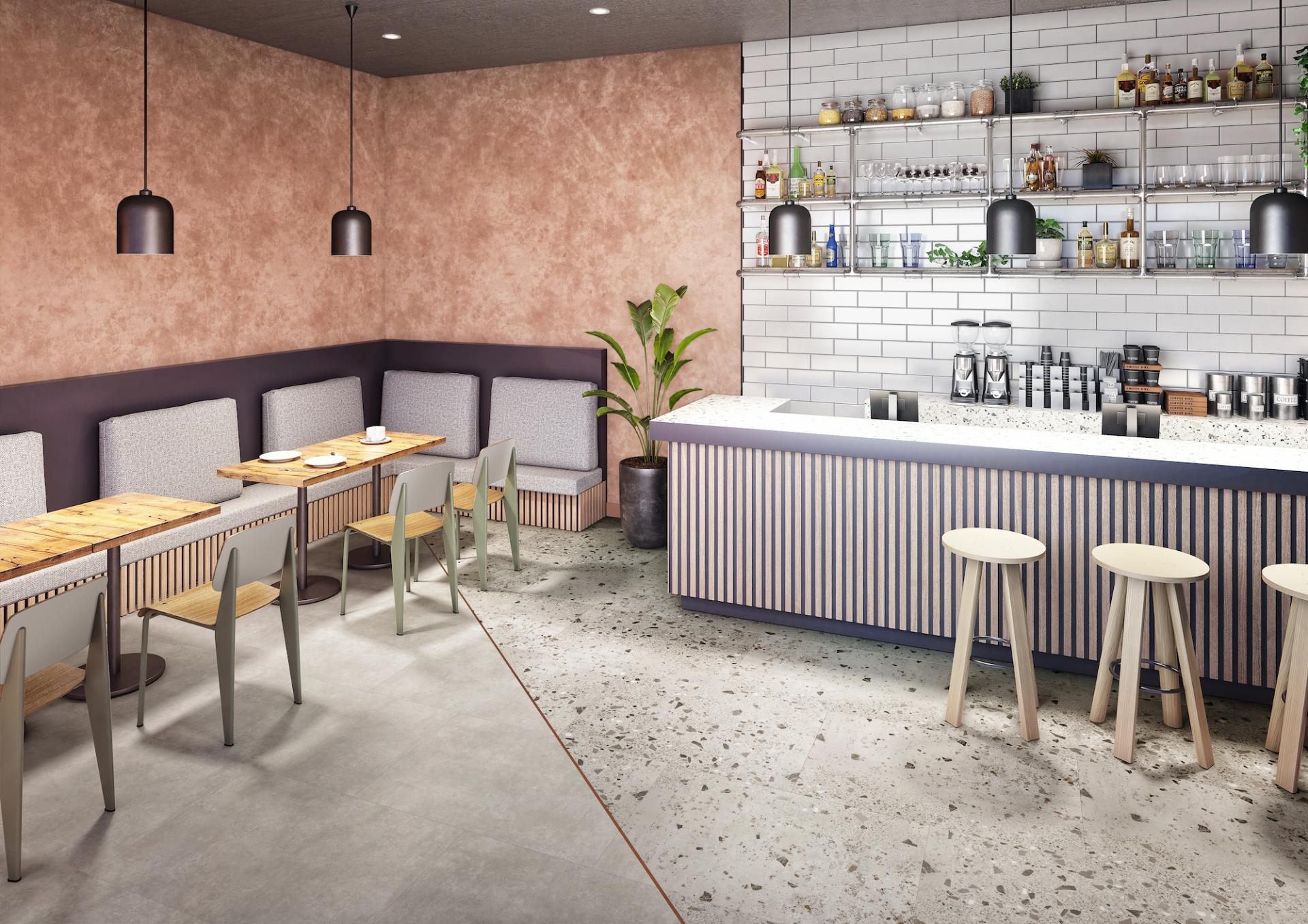 Stylish café interior featuring safety flooring, modern furniture, and a welcoming atmosphere for commercial spaces.