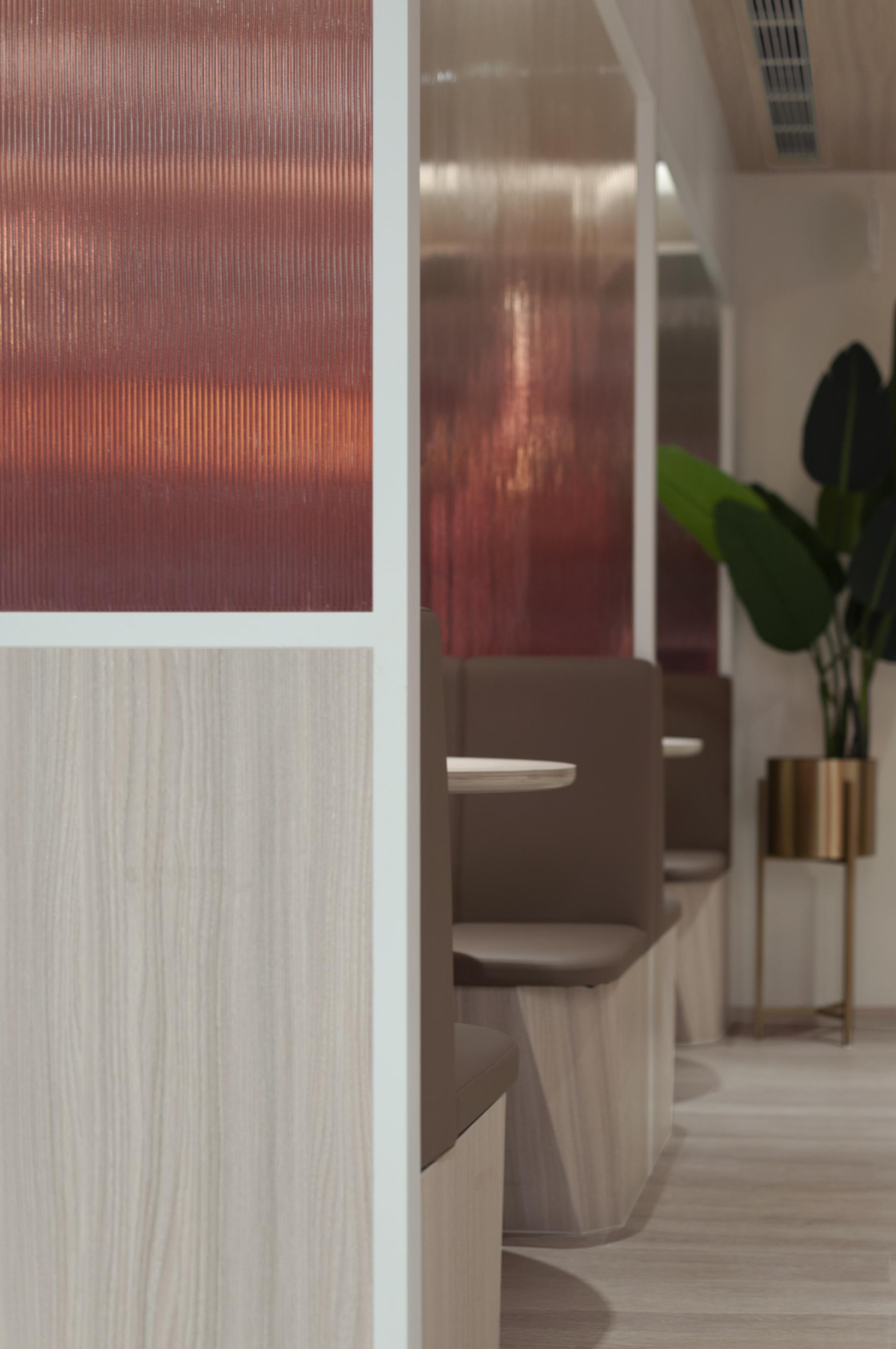 Modern office interior of Unicorn Stores HQ featuring sleek design elements and greenery.