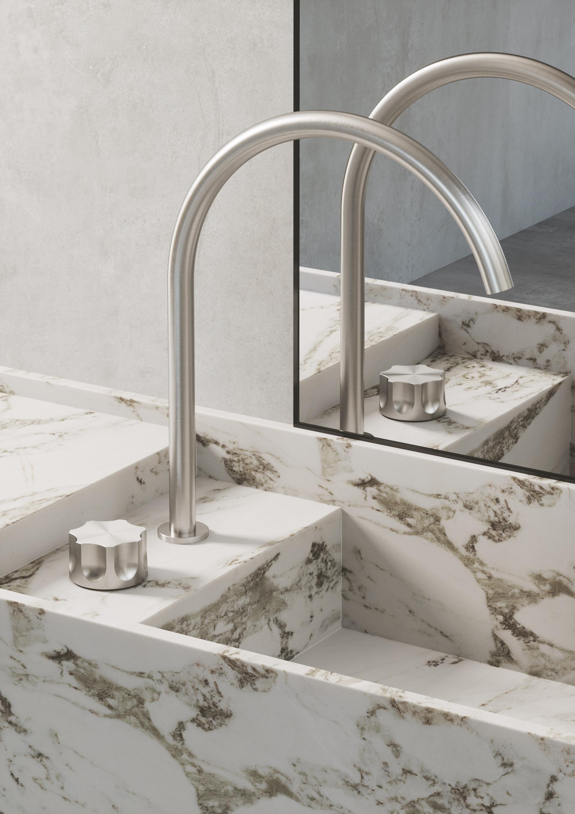 Sophisticated sink design featuring a sleek faucet and marble finish, showcasing Quadro Design Italy's new product line.