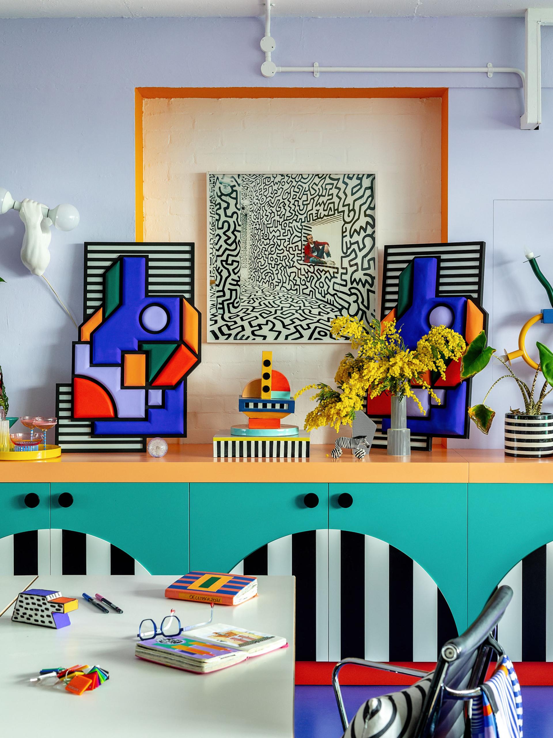 Vibrant studio interior showcasing Camille Walala's signature bold geometric art, colorful decor, and creative workspace elements.