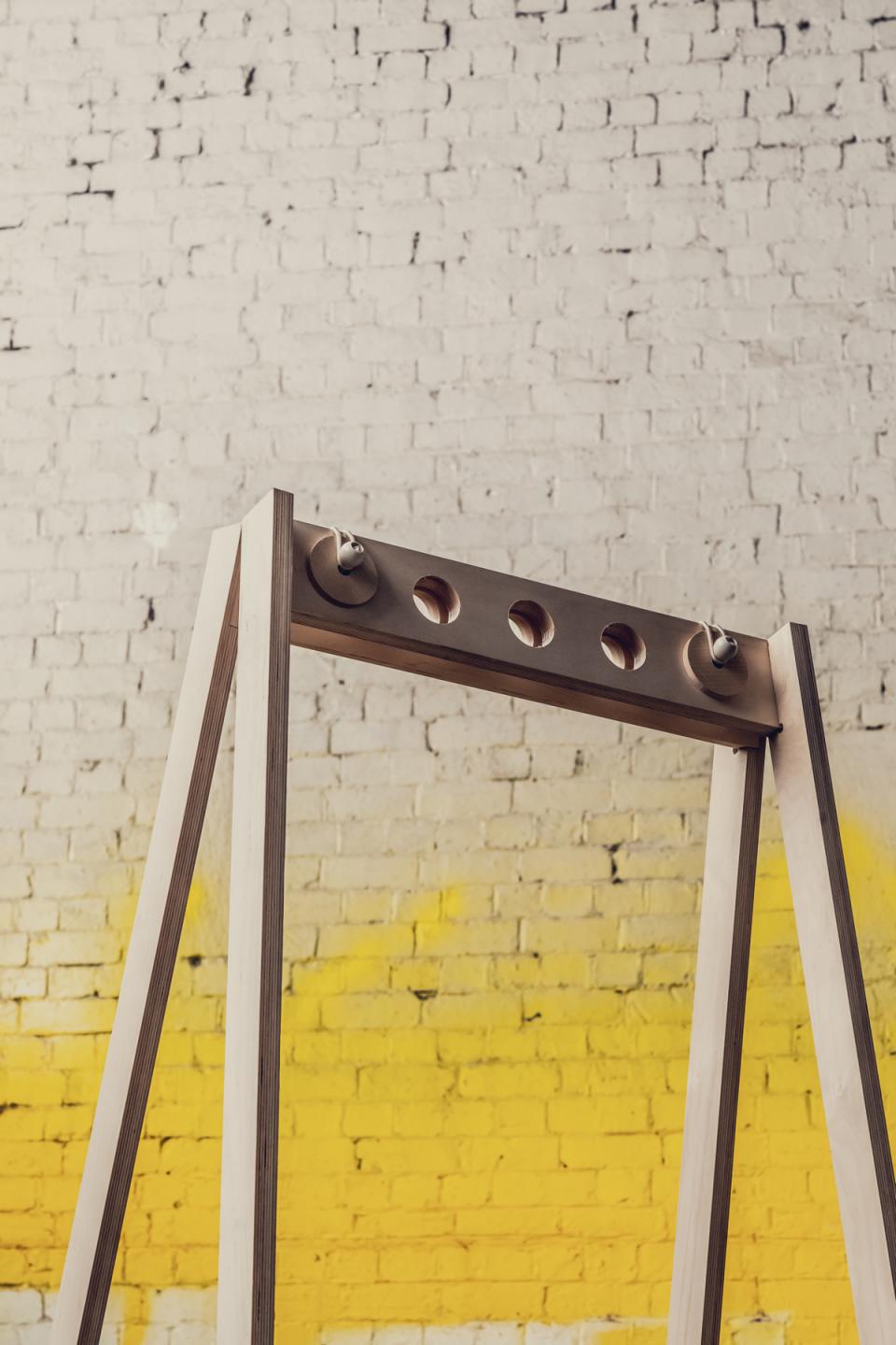 Flexible furniture display featuring a modern wooden frame, designed for pop-up shops and creative installations.