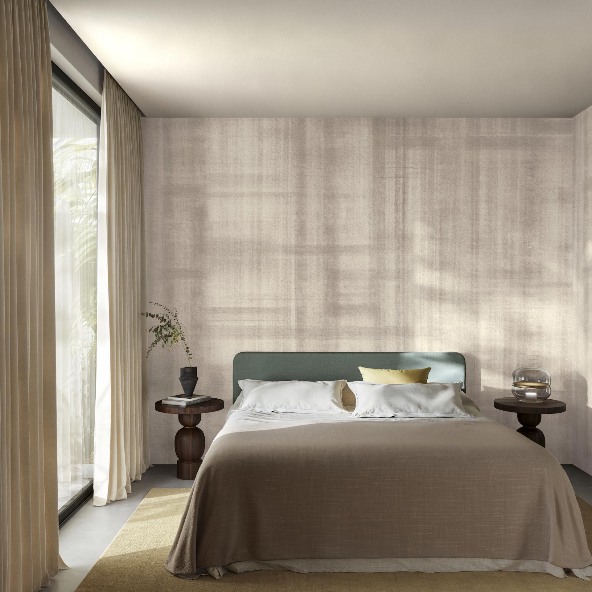 Stylish bedroom featuring Arte's autumnal wallcovering, Brushed Suede, with a calming neutral palette and elegant decor.