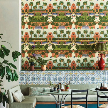 Vibrant Cole & Son Seville wallpaper featuring lush greenery and architectural motifs, enhancing a stylish interior decor setting.