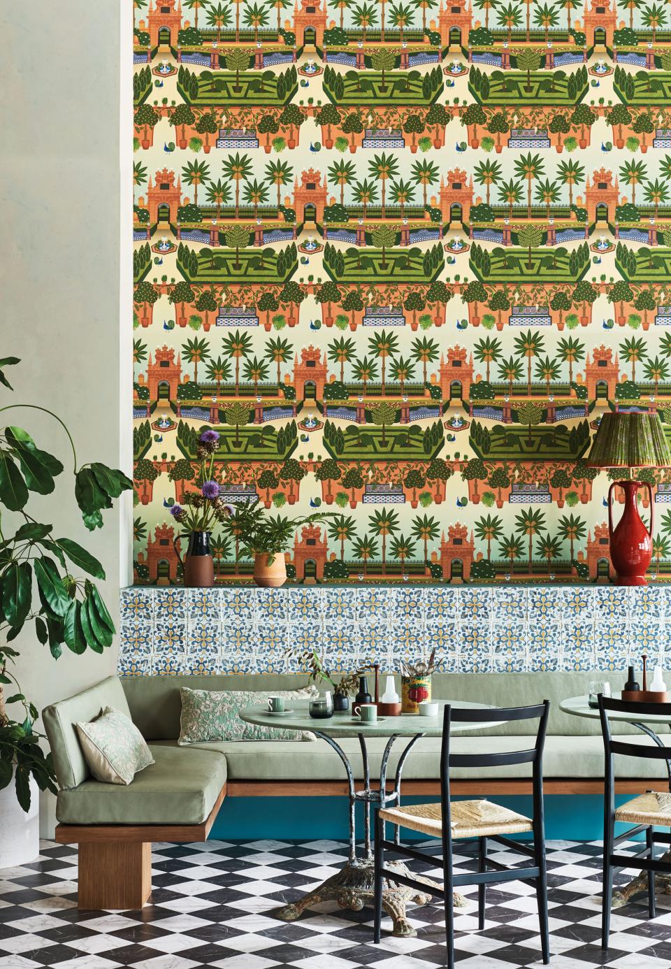 Vibrant Cole & Son Seville wallpaper featuring lush greenery and architectural motifs, enhancing a stylish interior decor setting.