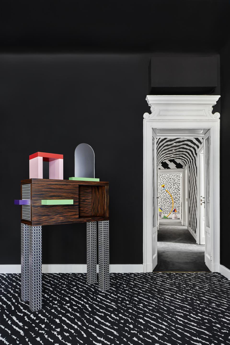 Colorful Memphis Milano furniture piece in a modern interior showcasing bold patterns and sleek design elements.