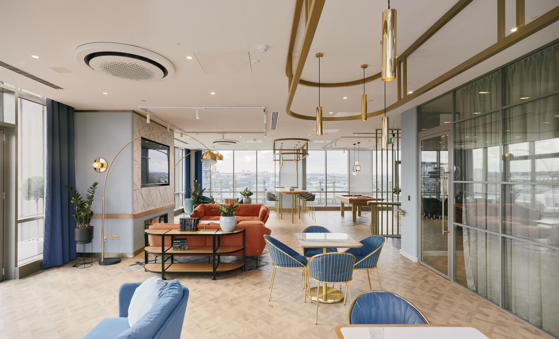 Stylish residential amenity space at The Headline, Leeds, featuring modern furnishings and vibrant decor for communal living.