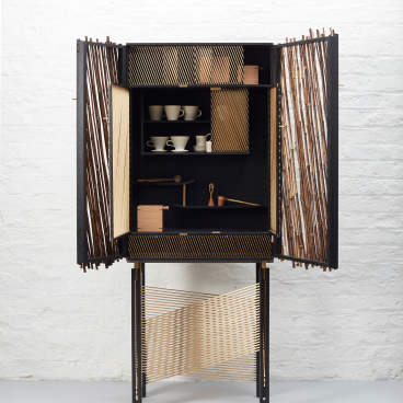 Japanese-inspired black stained drinks cabinet with decorative bamboo elements and interior shelving for cups and accessories.
