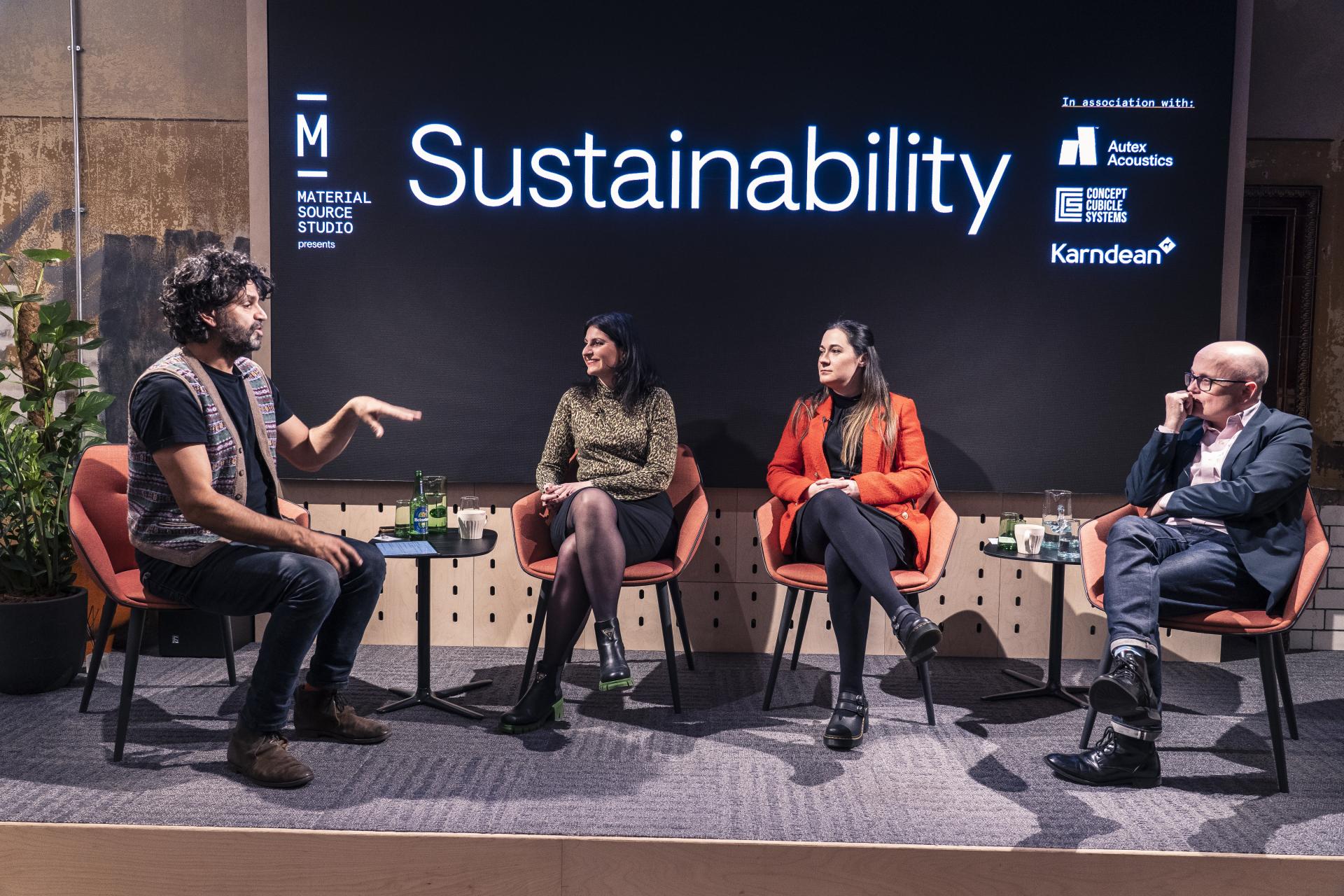 Panel discussion on sustainability at Material Source Studio, featuring speakers engaged in conversation about eco-friendly practices.