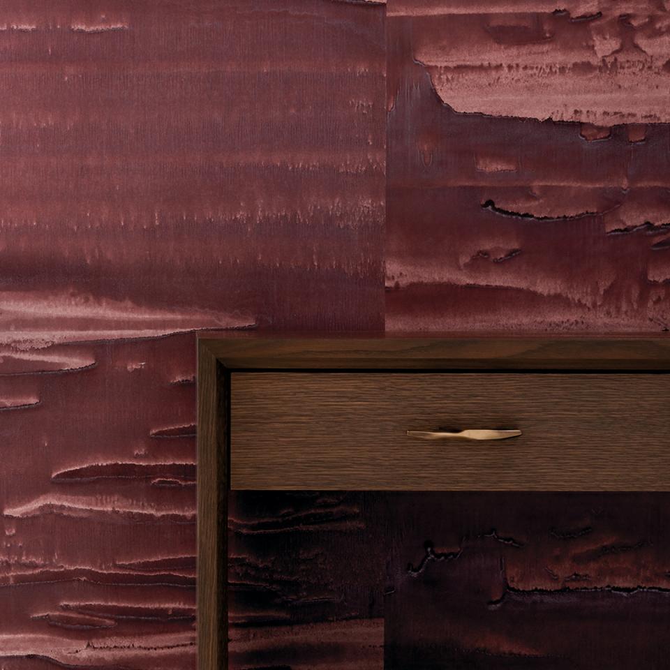 Rich red wallcovering design from HOLLY HUNT's new in-house portfolio, paired with a sleek wooden drawer.