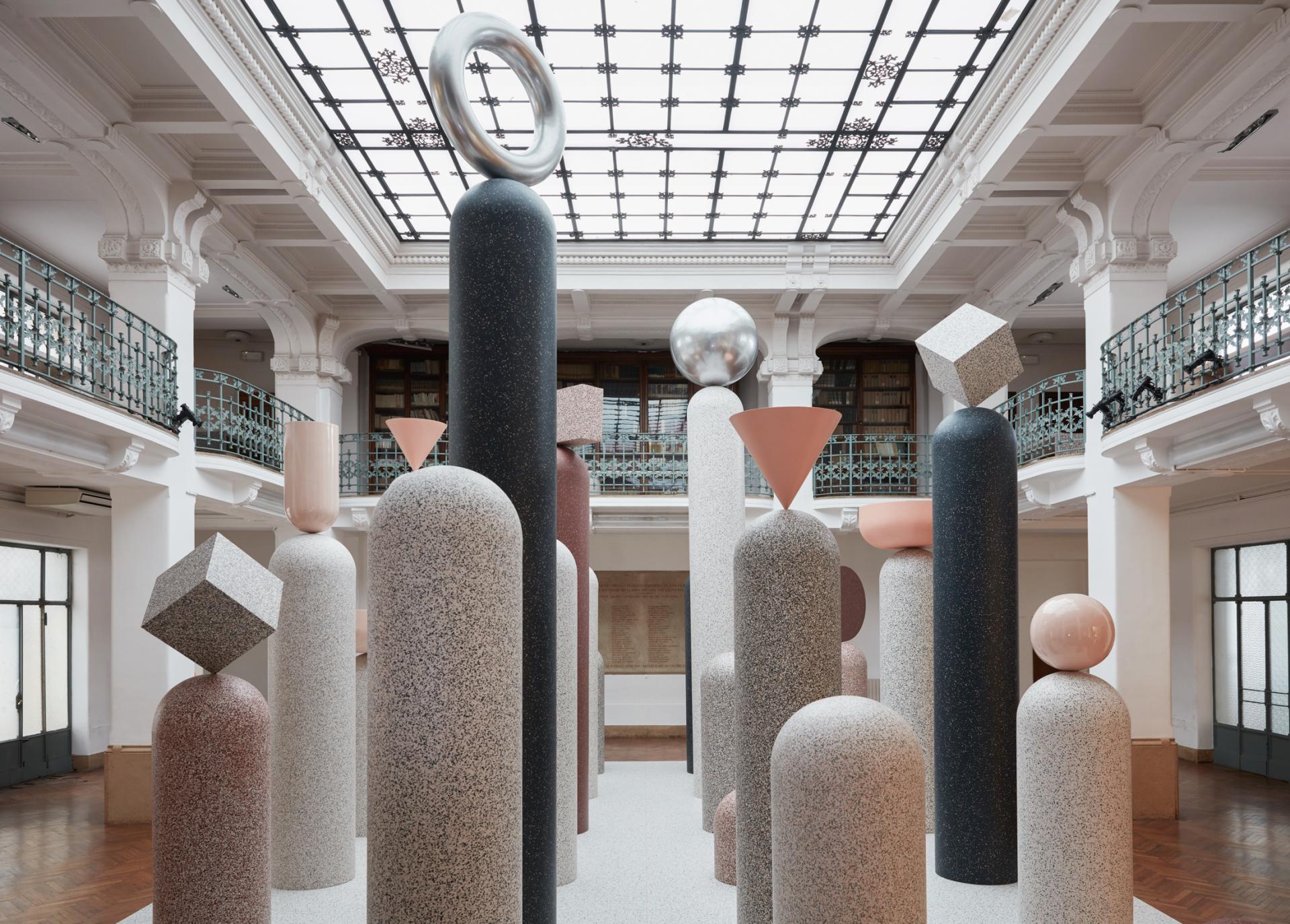 Abstract geometric sculptures exhibit modern industrial design at Tarkett's Formations installation during Milan Design Week.