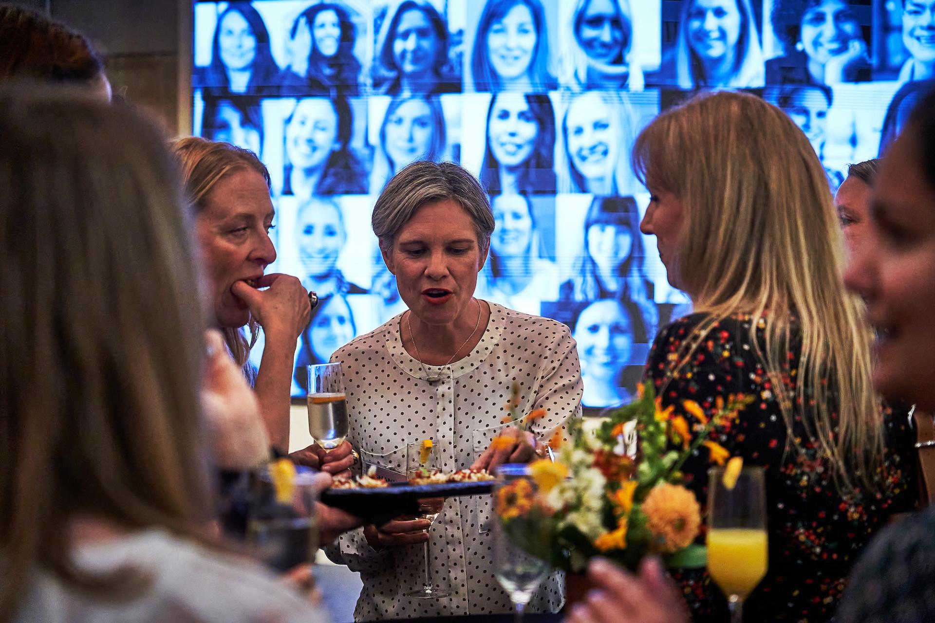 Attendees enjoy food and drinks at the 42 Gathering, celebrating the completion of the podcast 42 Roles in the Built Environment.