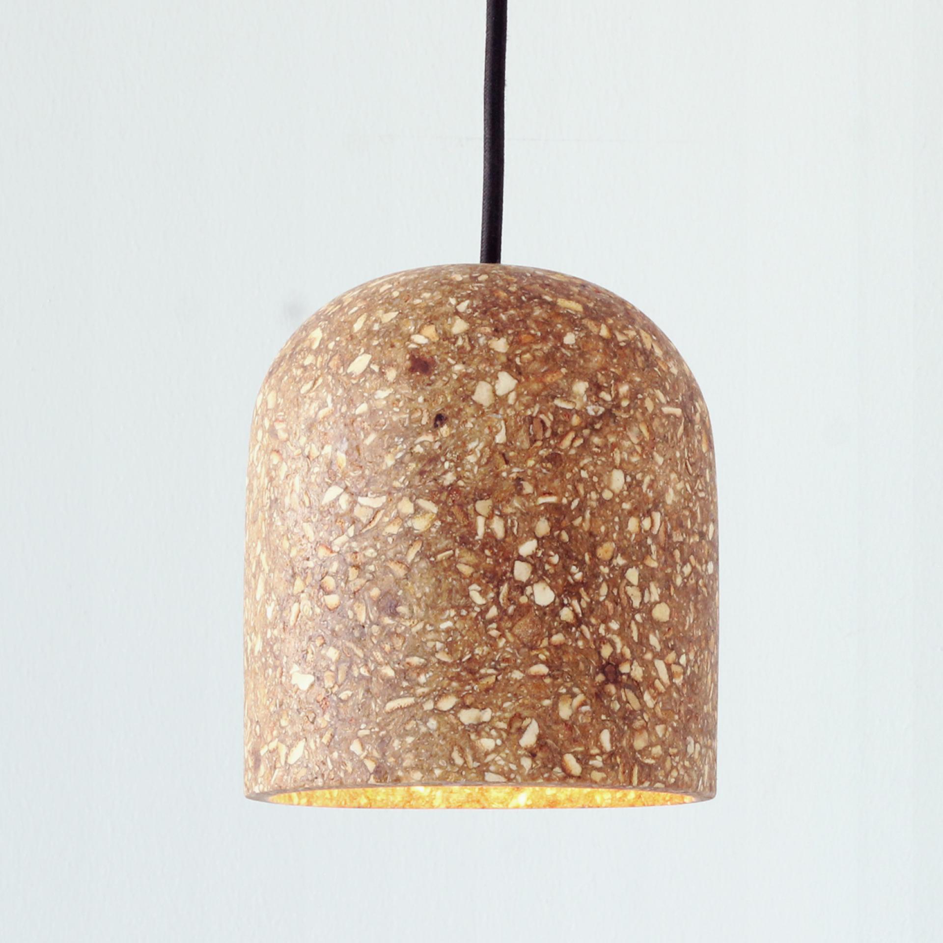 Sustainable cork pendant light designed by Caracara Collective, showcasing innovative material use in modern lighting solutions.