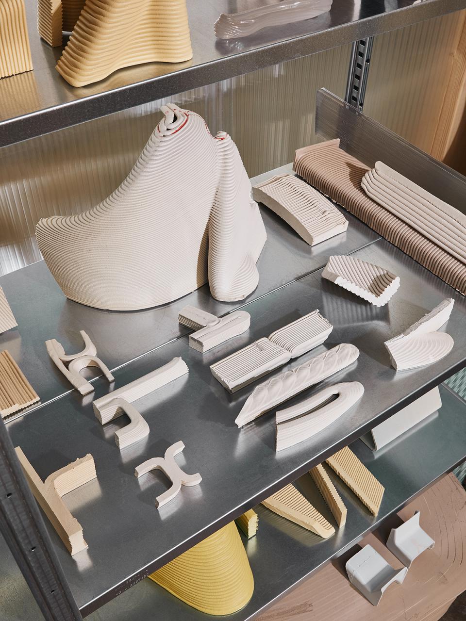 Sculptural prototypes of the Ermis chair by The New Raw, showcasing innovative, zero-waste design techniques.