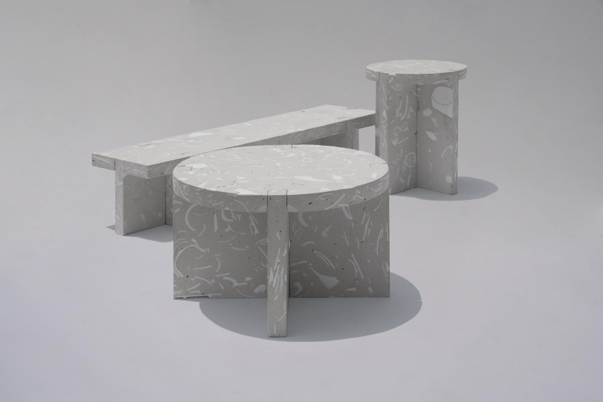 Contemporary concrete furniture pieces in subtle gray tones, showcasing unique design, featured at Surface Design Show 2019.