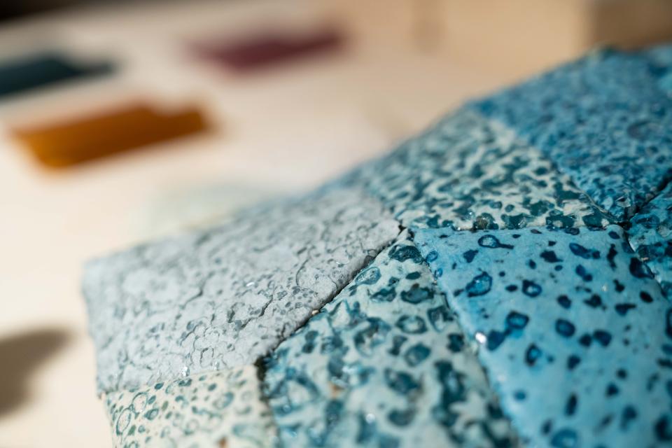 Close-up of textured biomaterials showcasing various blue hues, featured in the "From The Ground Up" exhibition at Material Source Studio.