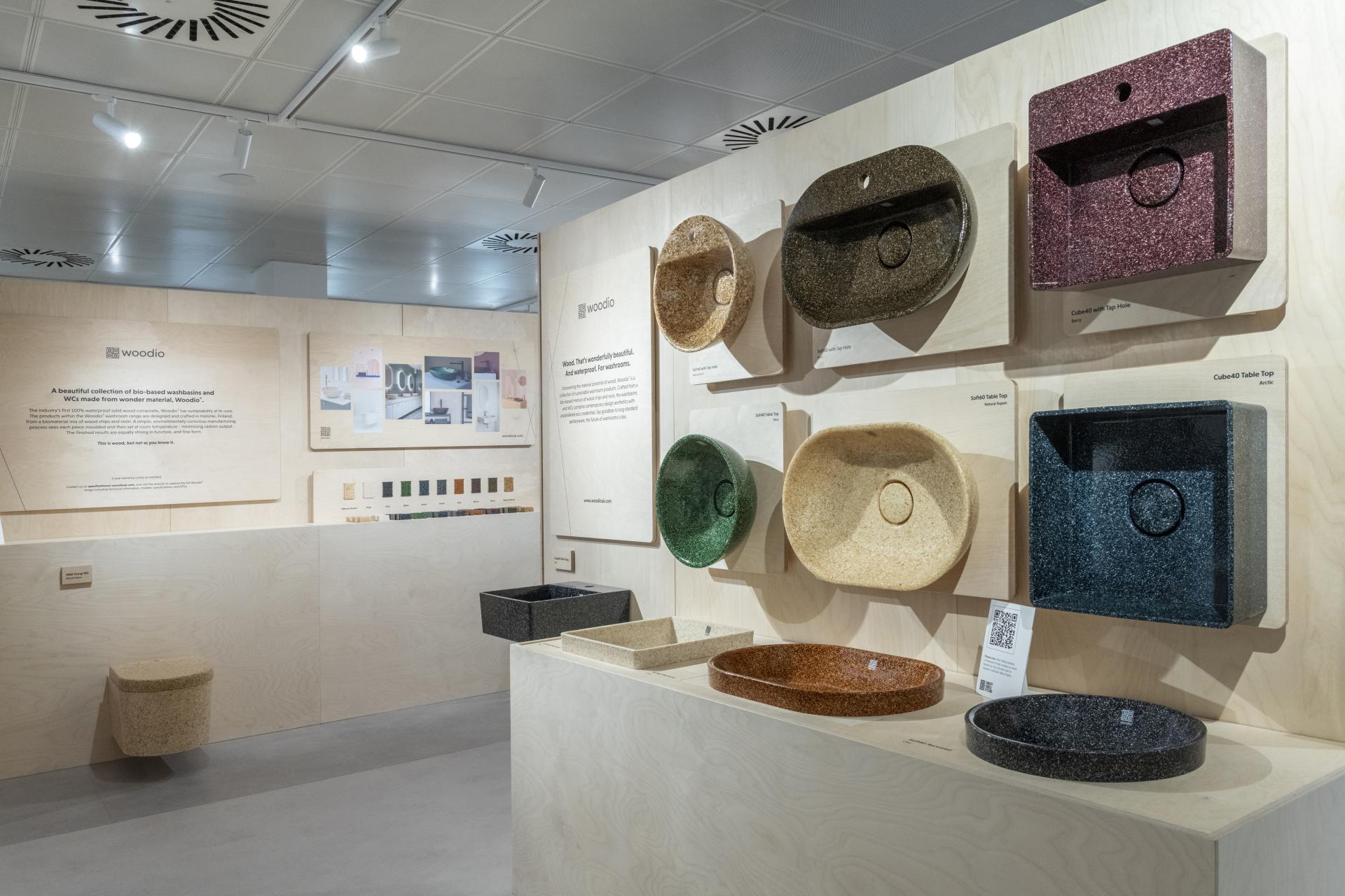 Stylish wood composite washroom sinks showcased in a modern display, highlighting Woodio's sustainable design solutions.