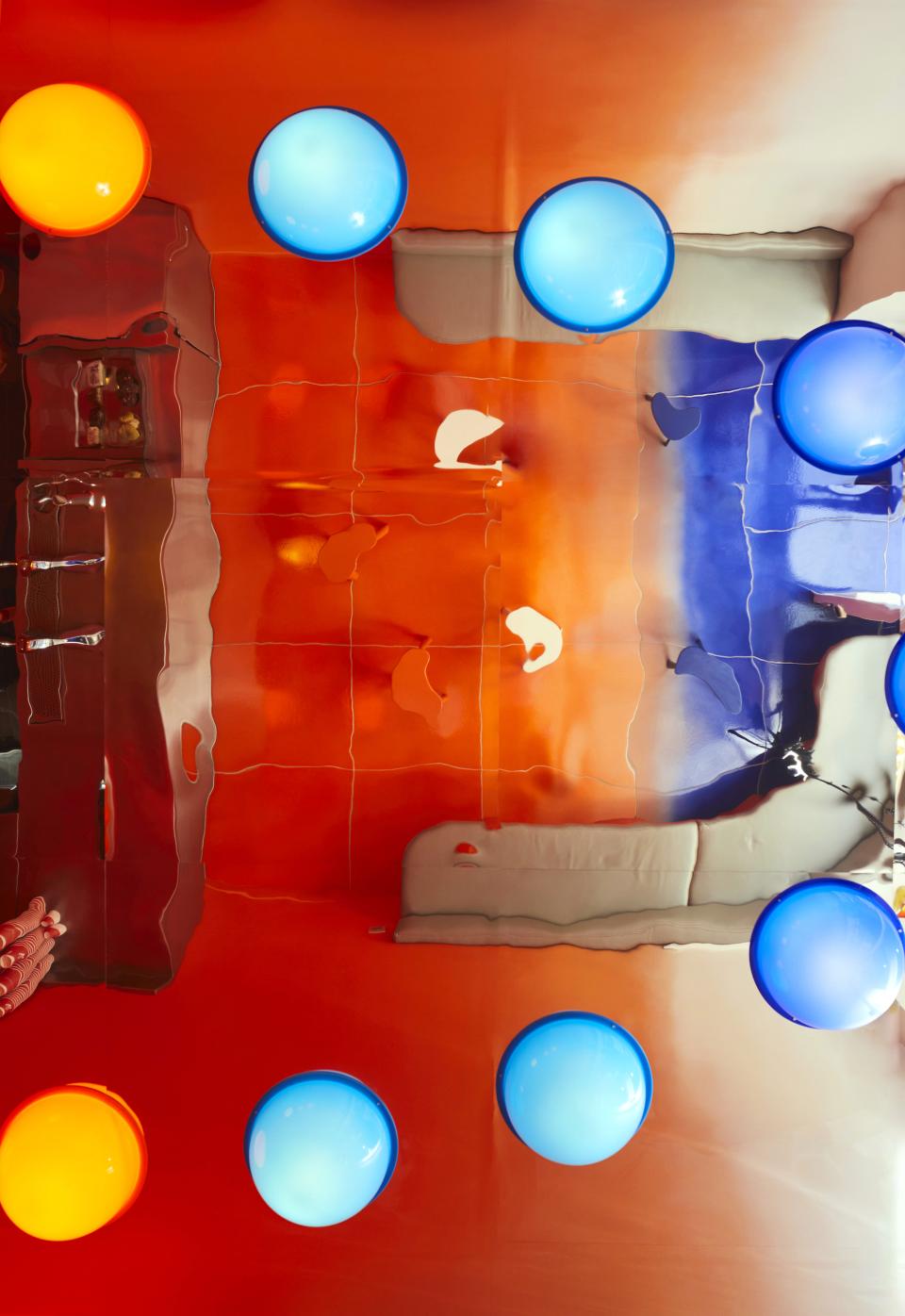 Vibrant overhead view of a colorful café table adorned with blue and orange round decor, showcasing psychedelic design elements.