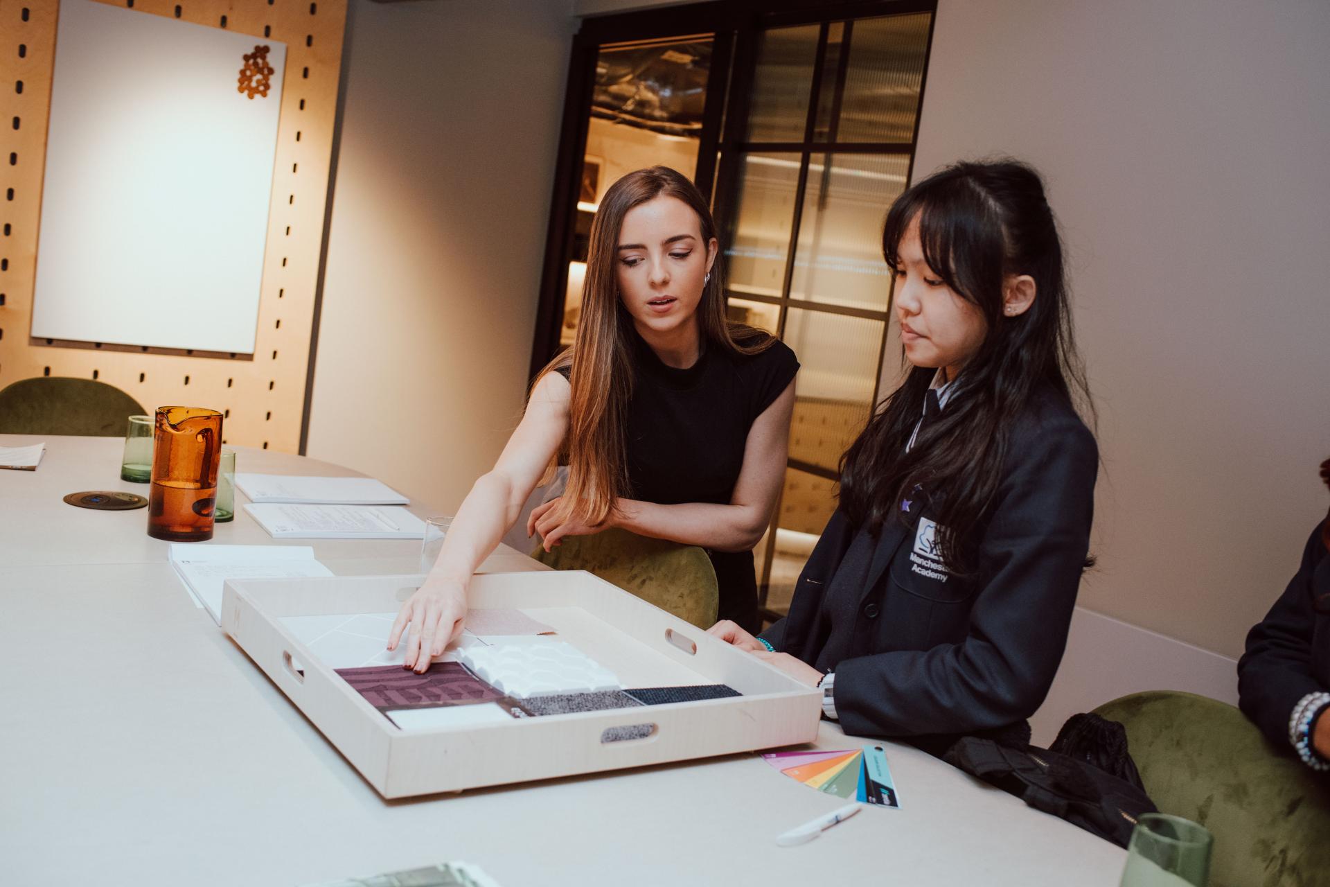 Creative collaboration between an interior designer and Manchester Academy student, exploring design materials and color palettes.