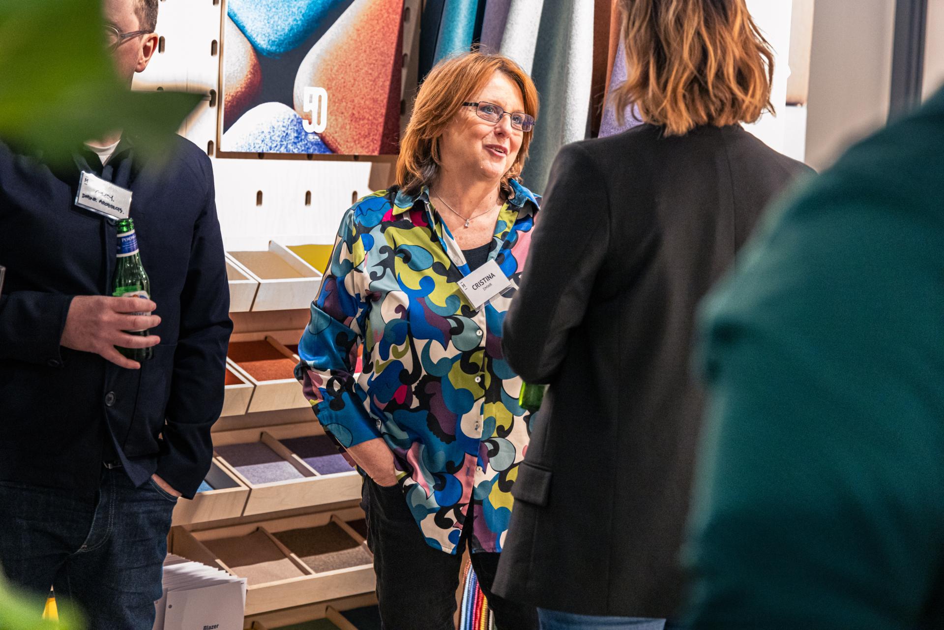 Attendees engage in lively discussion at the Material Source Studio seminar on Manchester property growth trends.