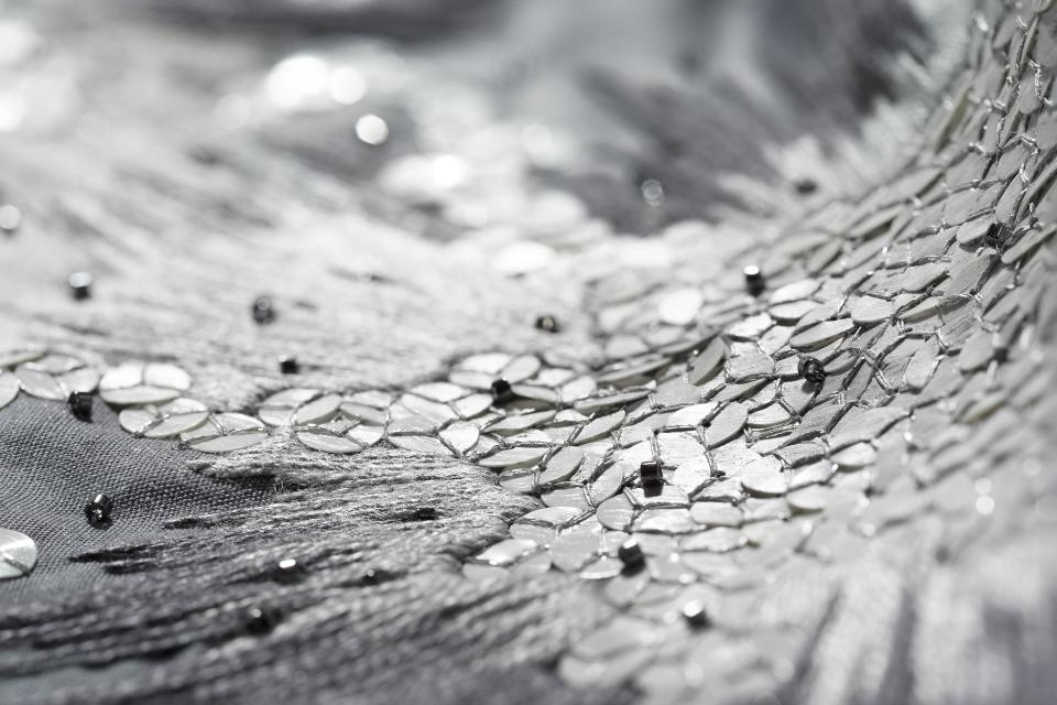 Intricate embroidery detail featuring shimmering sequins and beads, showcasing craftsmanship at the Future Icons Selects exhibition.