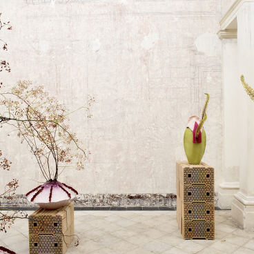 Art installation featuring unique sculptures and floral elements at Contemporary Cluster's new space in Palazzo Brancaccio, Rome.