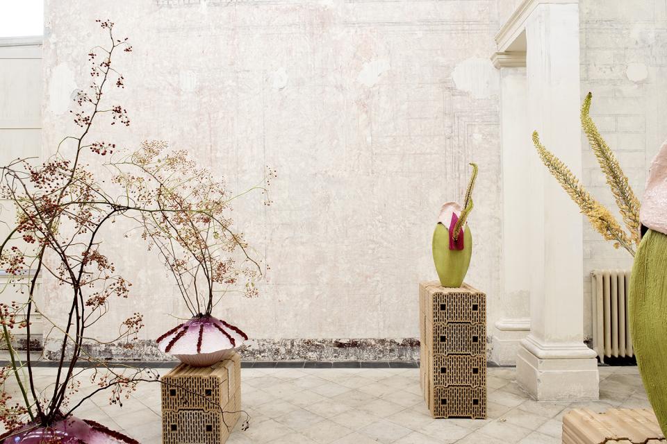 Art installation featuring unique sculptures and floral elements at Contemporary Cluster's new space in Palazzo Brancaccio, Rome.