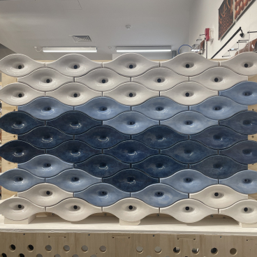 Ceramic sound-absorbing tiles designed to reduce noise pollution, displayed at the Bartlett School of Architecture.