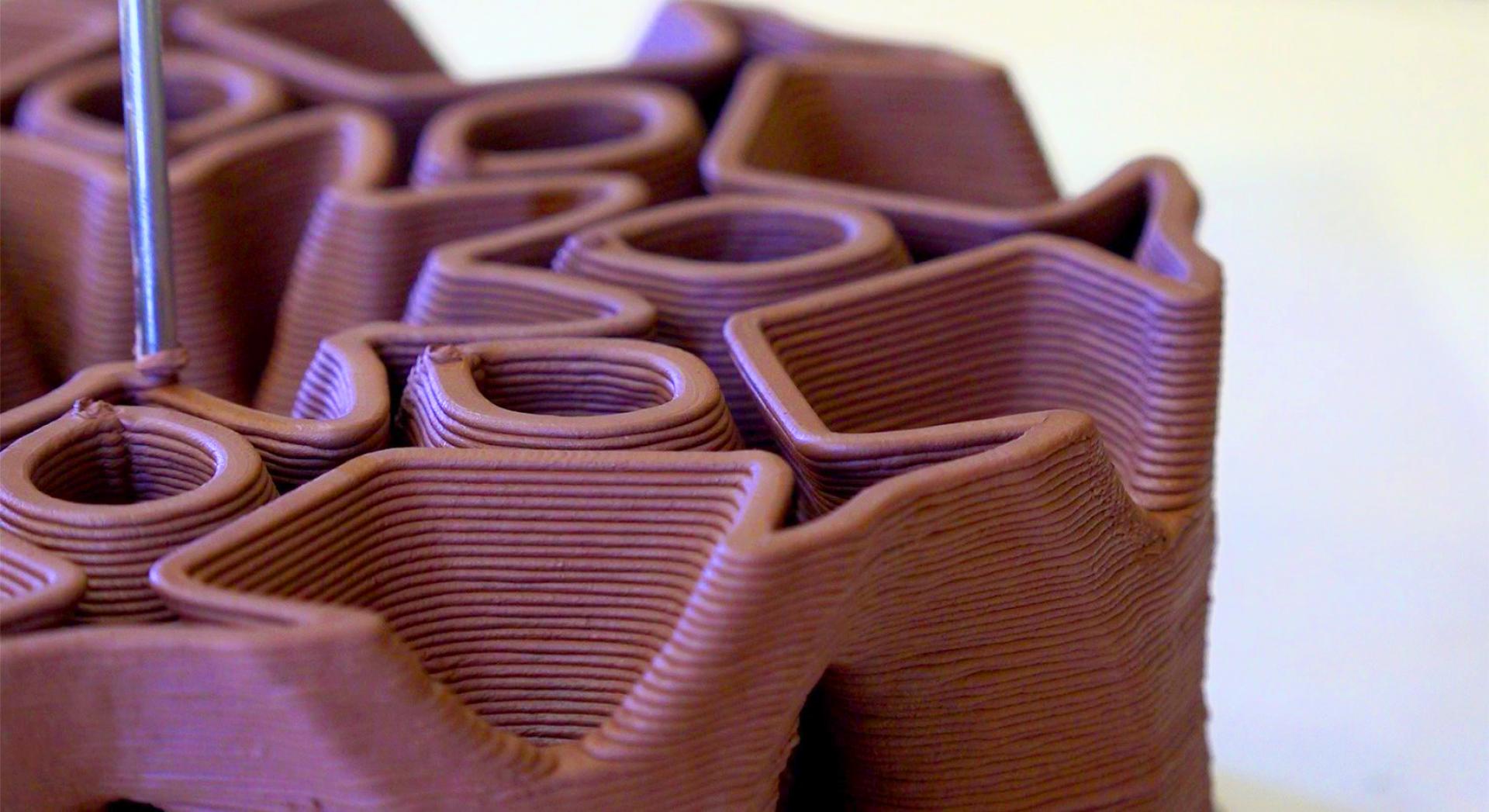 Detailed close-up of a clay 3D printed structure designed for efficient building cooling solutions by Rameshwari Jonnalagadda.